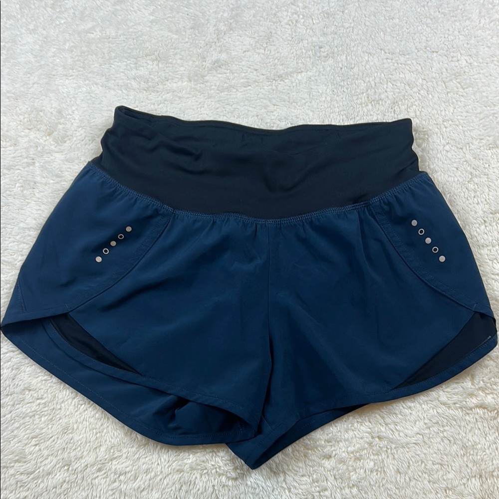 COREIO Women’s Blue and Black Athletic Shorts with Curved Hem
